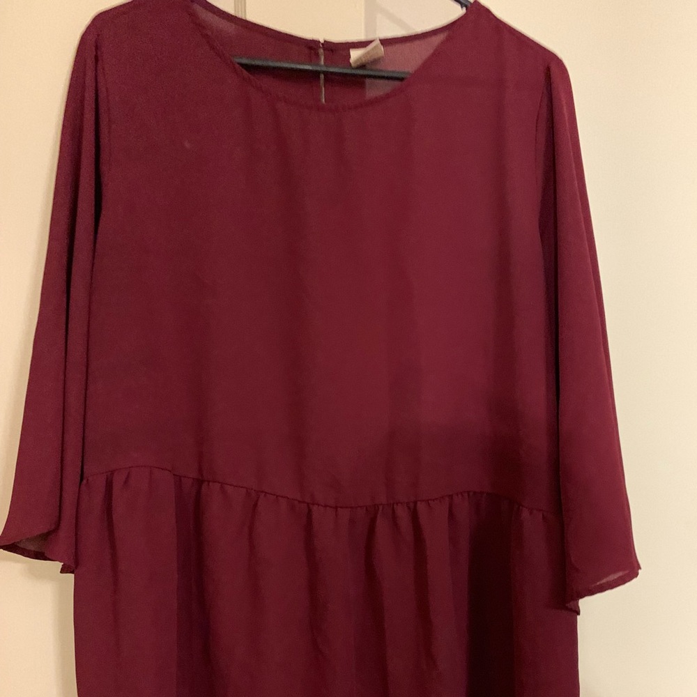 Maroon shirt.